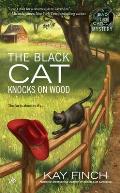 The Black Cat Knocks on Wood